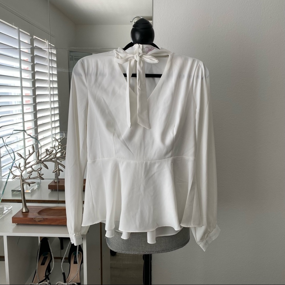 White blouse with bow tie detail